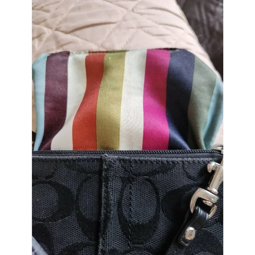 Coach black Signature Jacquard small Zip Wristlet with 65th anniversary lining